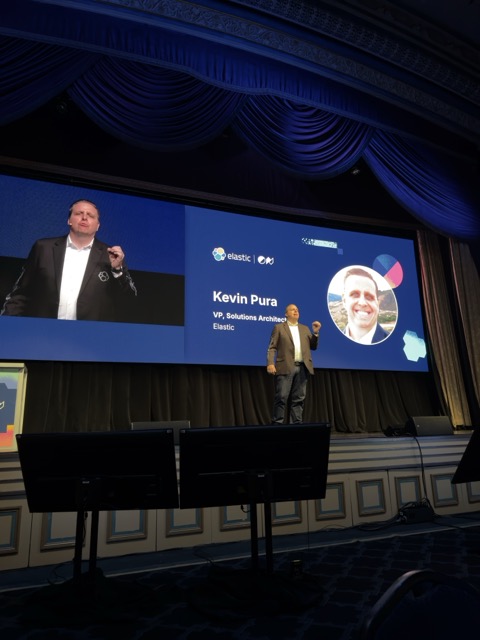 Elastic executive Kevin Pura speaking on stage.