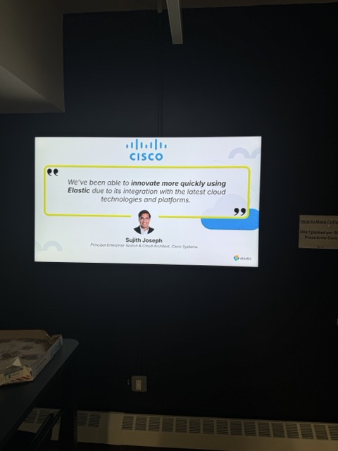 A Cisco customer quote slide shown during an Elastic event.