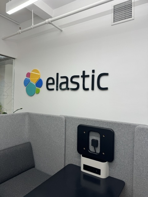 Elastic logo on an office wall.