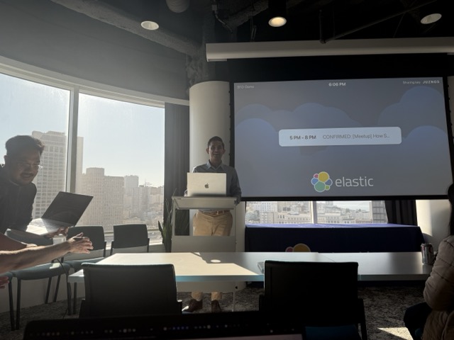 A wide shot of BK Bhate speaking at an Elastic community session.