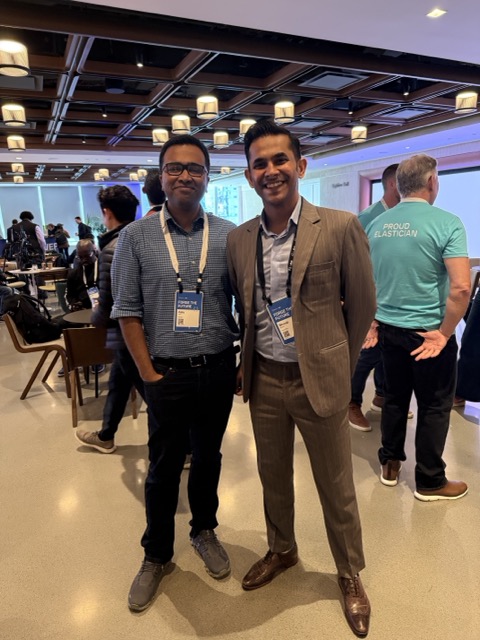 BK Bhate with another attendee at an Elastic event.